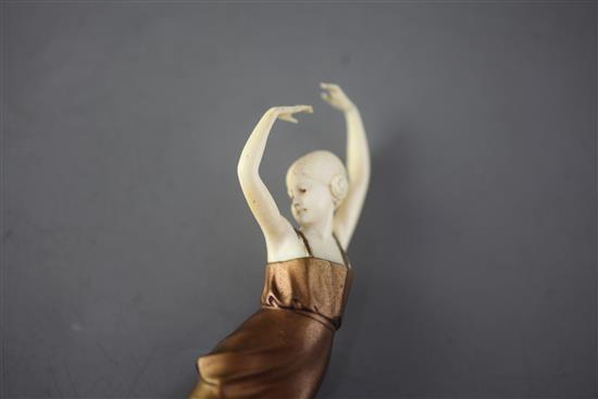 An Art Deco ivory and cold patinated bronze figure of a dancing girl, height 7in.